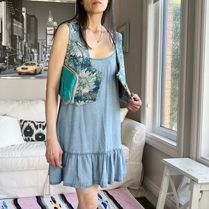 Blue chambray minidress with ruffle hem